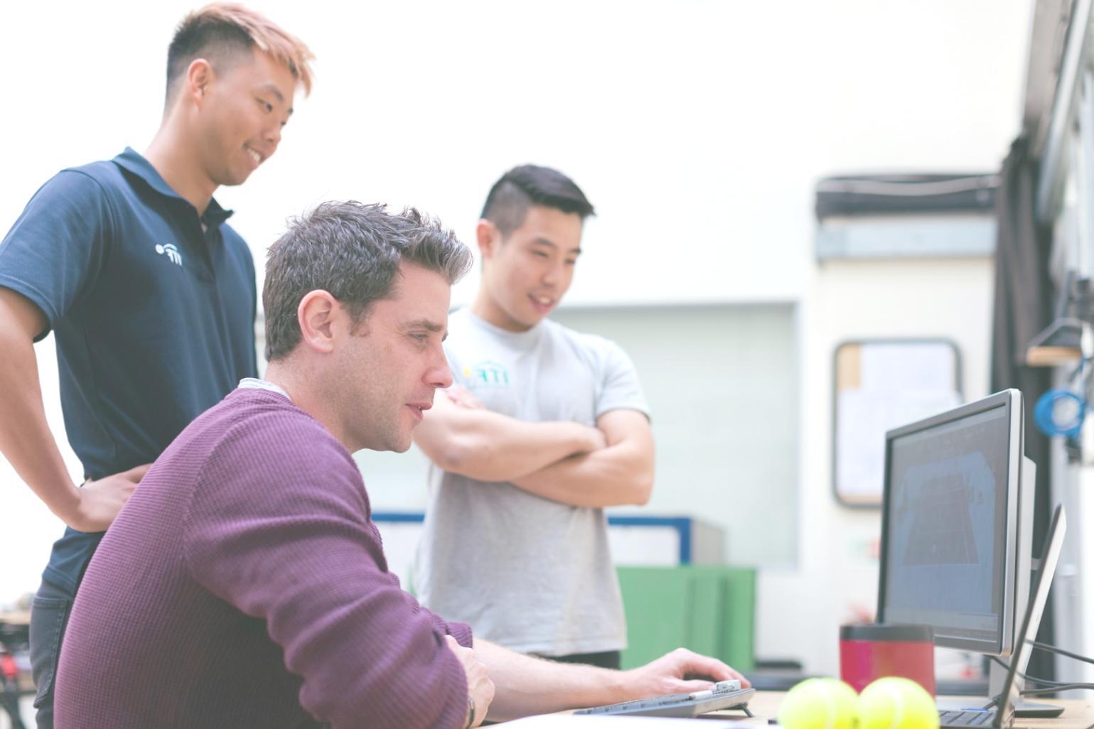 Final project presentations with students demonstrating their blockchain applications to industry experts